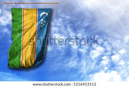 Flag of Karakalpakstan. Vertical flag, against blue sky with place for your text