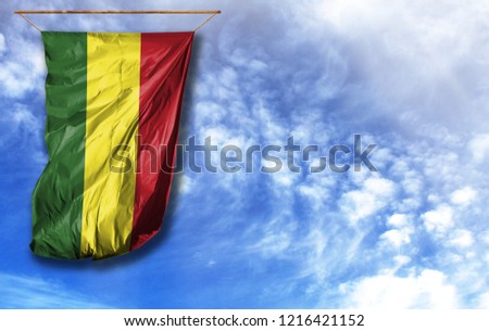 Flag of Bolivia. Vertical flag, against blue sky with place for your text