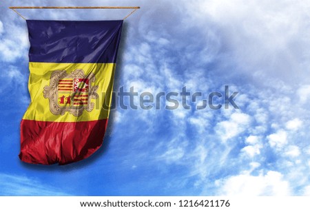 Flag of Andorra. Vertical flag, against blue sky with place for your text