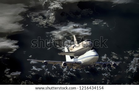 space shuttle and plane fly in space over earth atmosphere, elements of this image furnished by NASA