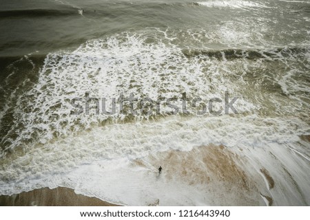 Aerial of Surfers in Big Waves in Belmar New Jersey