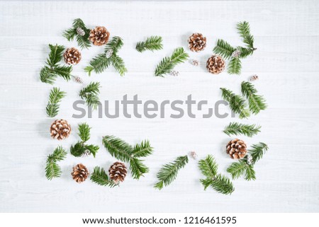 Festive composition of Christmas decorations on white wooden background. Flat lay with copy space. New year holiday frame.