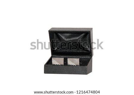 Cufflinks in a decorative box isolated