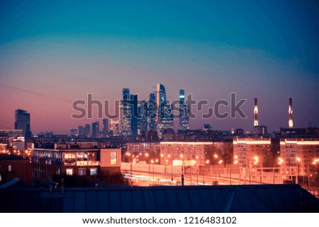 Houses of night metropolis. Panorama of the big city at night