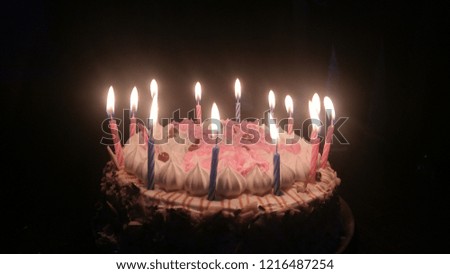 A NIGHT OF CELEBRATION WITH DELICIOUS CAKE AND CALMING LIGHT OF CANDLES 