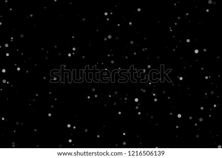 Falling snow isolated on black. Snowfall texture. Place in over picture in screen mode.