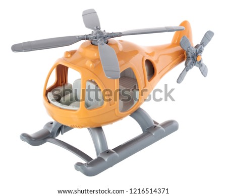 Plastic toy helicopter isolated on white background. Yellow helicopter.