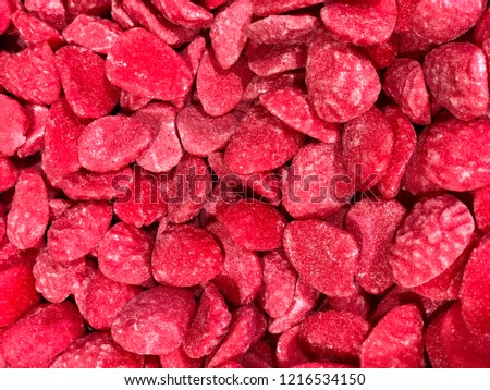 The picture shows red candies  from the candy store.