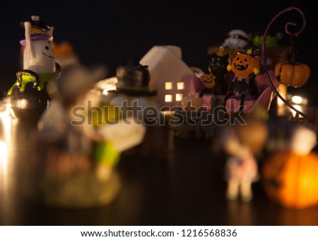 boy and girl hesitate to enter Halloween festival party house which is full with ghosts and monsters. Festive Celebration, Holidays, Fun, Halloween toy and doll decoration theme concept.