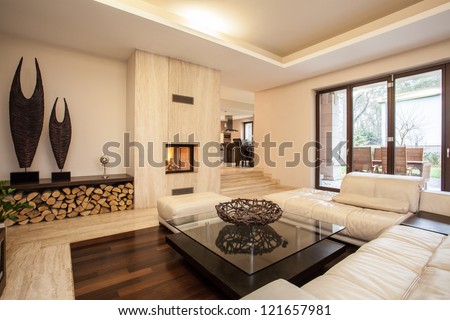 Travertine house: interior of beige living room Royalty-Free Stock Photo #121657981