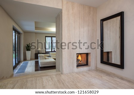 Travertine house: Horizontal view on entrance to living room Royalty-Free Stock Photo #121658029