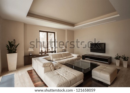 Travertine house: Horizontal view of a living room interior Royalty-Free Stock Photo #121658059