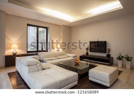 Travertine house: View on bright,unusual living room Royalty-Free Stock Photo #121658089