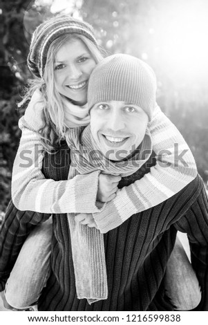 young couple in love in the park in winter