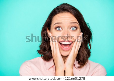 Close-up portrait of crazy emotional cheery cheerful nice lovely attractive charming girl showing omg gesture palms on cheeks isolated over turquoise teal green pastel background