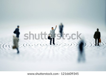 Miniature people : Businessman standing on start point of maze, Picture user for business finding solution, problem solving and challenge concept.