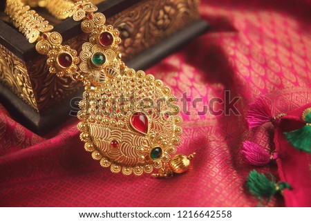 Indian Traditional Gold Necklace with Gemstones Royalty-Free Stock Photo #1216642558