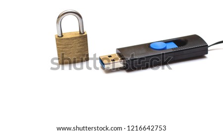 The concept of information storage. Padlock and usb flash drive. locked closed padlock with usb memory stick through it isolated on white background