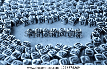 Pronoun - Word from Metal Blocks on Paper - Concept Photo on Table
 Royalty-Free Stock Photo #1216676269