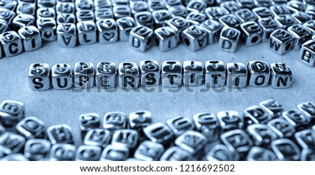 Superstition - Word from Metal Blocks on Paper - Concept Photo on Table
 Royalty-Free Stock Photo #1216692502