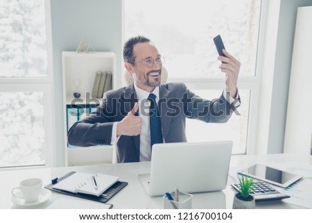 Attractive man in formal wear take selfie picture demonstration show symbol gesture trust perfect proud cool satisfaction recommend sit on chair armchair in office workstation