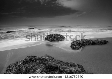 slow shutter speed effect  photo of beach in the evening, black and white
