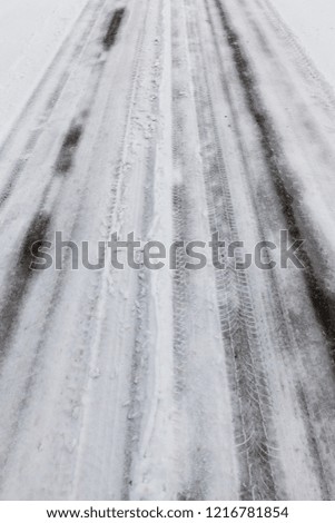 snow photographed in the winter season, which appeared after a snowfall, close-up road