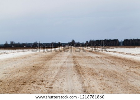 a snow covered road in the winter season, Closeup photo