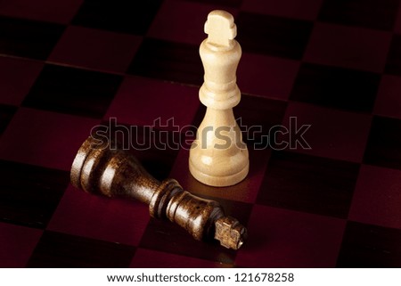 Classic Wooden Chessboard with Chess Pieces against a background