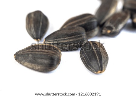 Sunflower seeds isolated on white background, close up.
