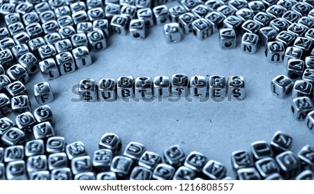 Subtitles - Word from Metal Blocks on Paper - Concept Photo on Table
 Royalty-Free Stock Photo #1216808557