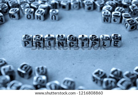 Principle - Word from Metal Blocks on Paper - Concept Photo on Table
 Royalty-Free Stock Photo #1216808860