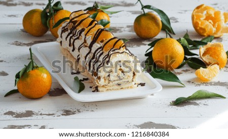 meringue roulade with cream and tangerines                  