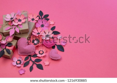 Vintage gift boxes in eco paper on pink background. Presents decorated with rose flowers sakura and leaves. soft felt heart.Valentine's day or other holiday concept, top view, flat lay, overhead view