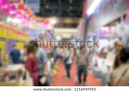 abstract blur people walking in exhibition for background
