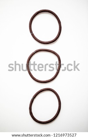 Brown hair bands or hair ties on a white background