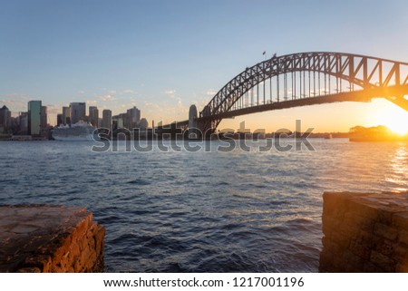 Sydney, the urban CBD landscape of the afterglow in the evening, the Harbour Bridge and the Opera House in the distance

