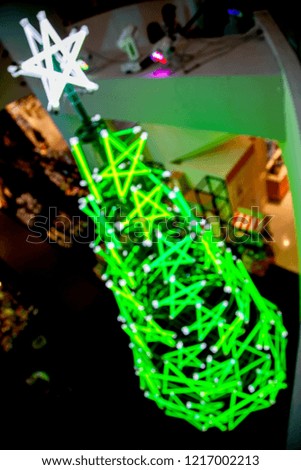 Blur image of shopping mall on Christmas time for background colorful bokeh lights decoration
