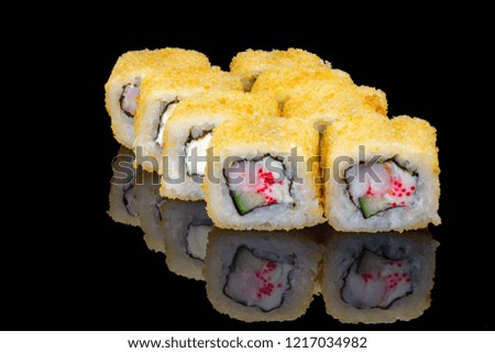 Sushi rolls on black glass, reflection .
