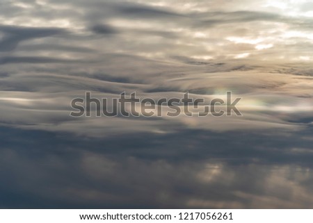 Cloudy pattern like liquid metal. Abstract backdrop