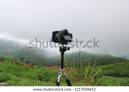 Photography view of digital camera with beautiful mountain background.
