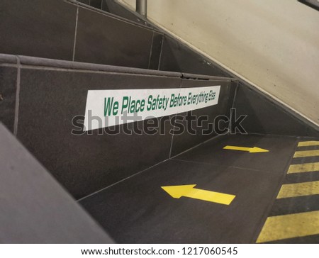 Phrase of 'We place safety before everything else' as a reminder at staircase
