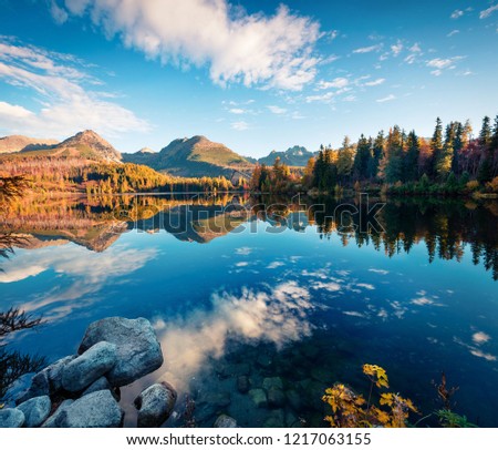 Wonderful autumn view of Strbske pleso lake. Romantic morning scene of High Tatras National Park, Slovakia, Europe. Beauty of nature concept background.