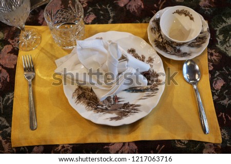Selective focus of Pinang Peranakan dining room plate setup. Royalty-Free Stock Photo #1217063716