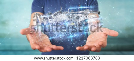 Businessman on blurred background using wireframe holographic 3D digital projection of an engine