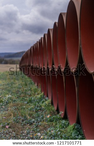 Stacked Oil pipes after production on a field