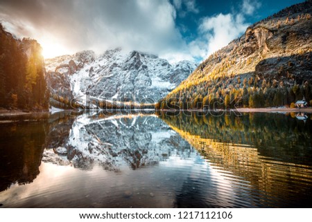 Autumn scenery of peaceful lake Braies (Pragser Wildsee). Location Dolomiti Alps, national park Fanes-Sennes-Braies, Italy, Europe. Scenic image of most popular travel destination. Beauty of earth.