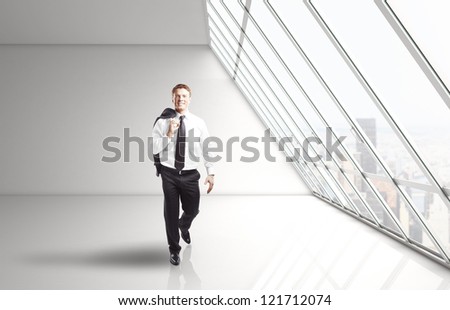 businessman walking in white office