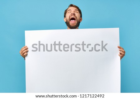 male mouth wide open holding a white drawing paper mockup             