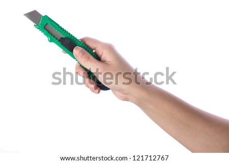 Hand holding paper cutter isolated on white background